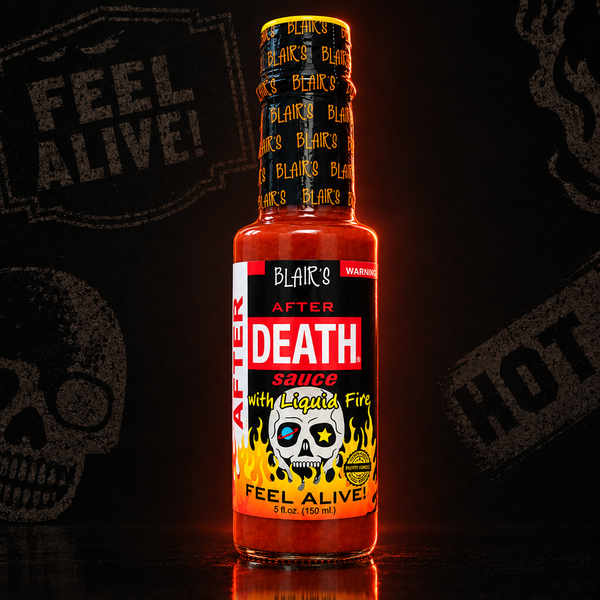 A 150ml bottle of Blair's After Death Sauce with Liquid Fire hot sauce on a dark background. Available to buy online in Australia.