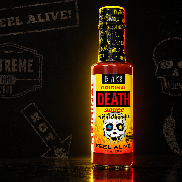 A 150ml bottle of Blair's Original Death Sauce with chipotle on a dark background. Buy online at Deathsauce Australia.